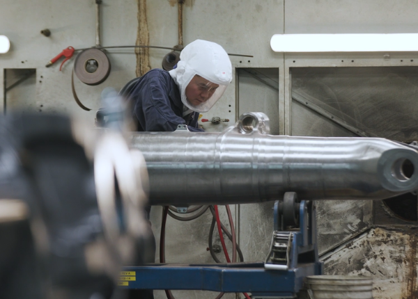 Heroux Devtek worker in a factory