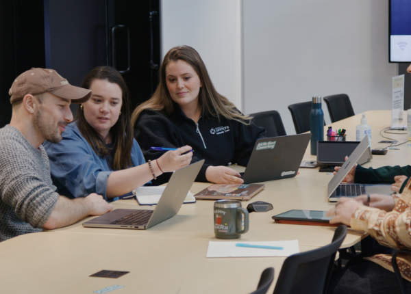 People sitting around a table at Catalyst Commons