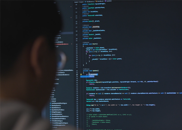 Tech worker in Waterloo looking at code