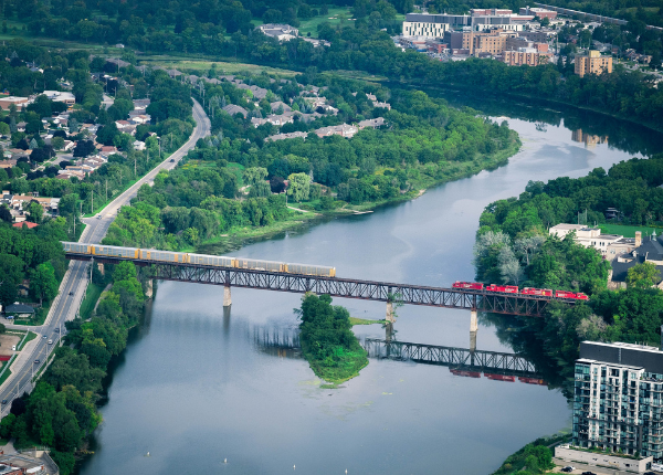 Two trains crossing over a river