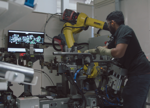 Manufacturing worker working on machine