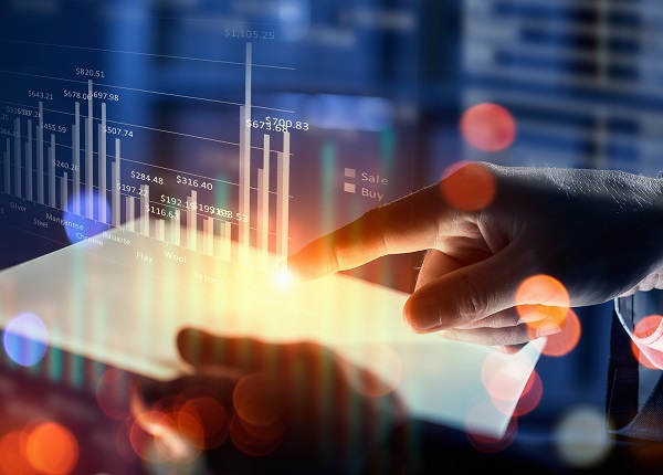 A tablet in hand showing bar graph