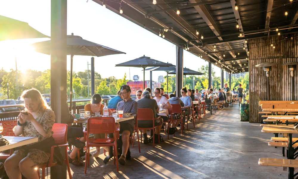 People enjoying a patio in the summertime